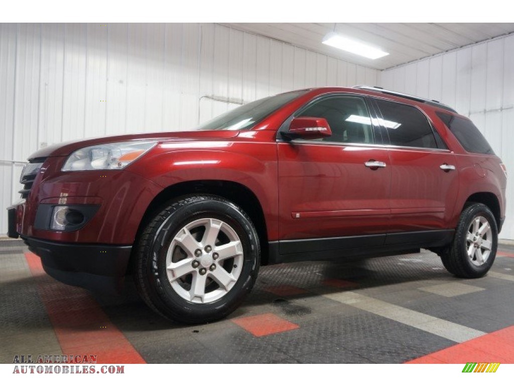 2009 Outlook XR AWD - Red Jewel Tintcoat / Black photo #2