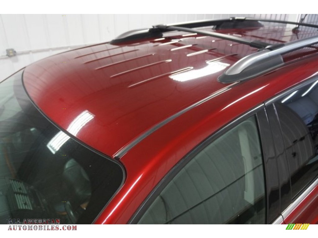2009 Outlook XR AWD - Red Jewel Tintcoat / Black photo #66