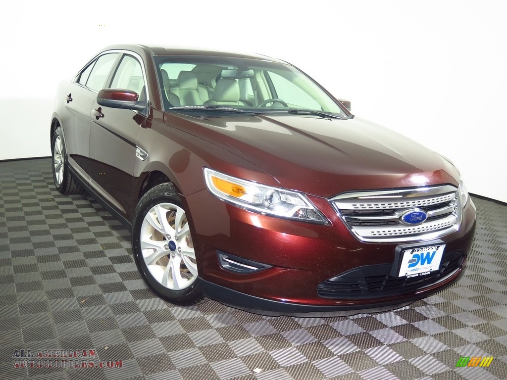 Red Candy Metallic / Light Stone Ford Taurus SEL