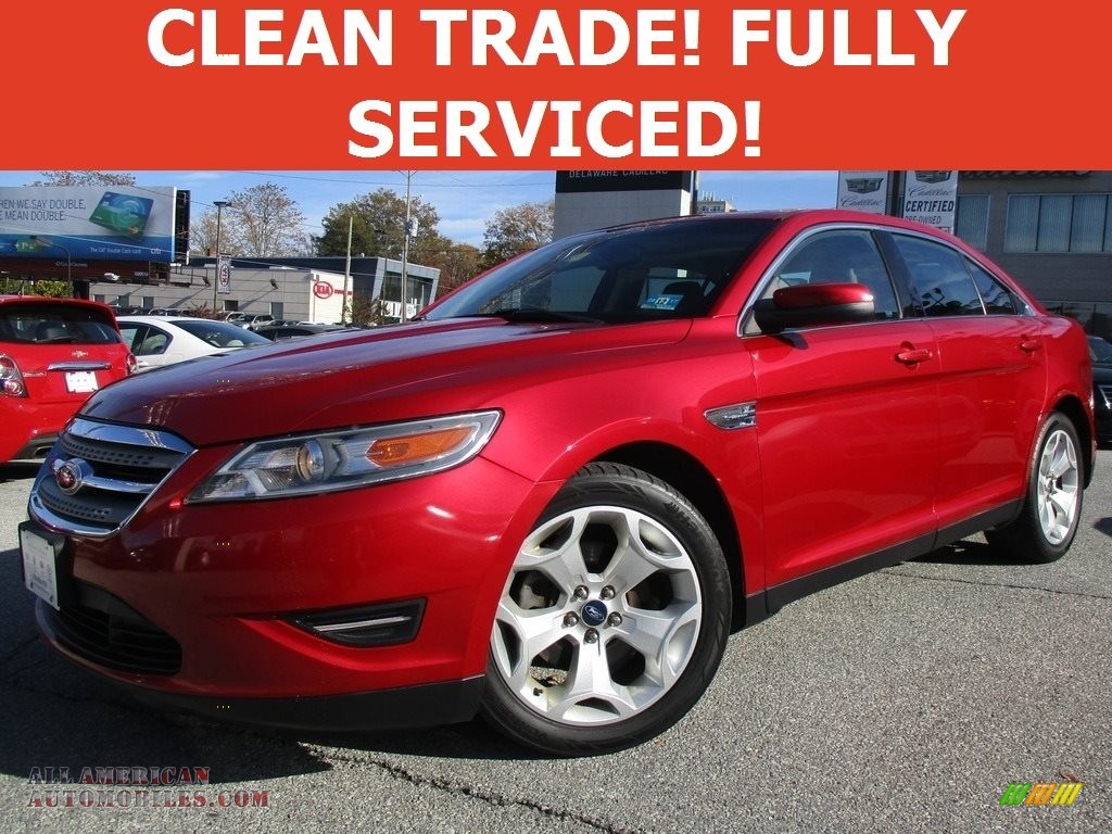 Red Candy / Charcoal Black Ford Taurus SEL AWD