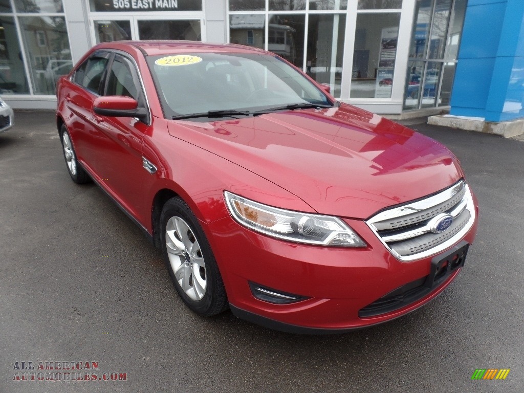 Red Candy Metallic / Charcoal Black Ford Taurus SEL