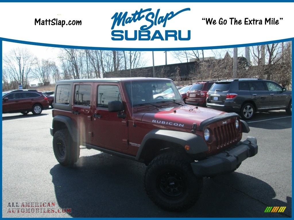 Deep Cherry Red Crystal Pearl / Black/Dark Saddle Jeep Wrangler Unlimited Rubicon 4x4
