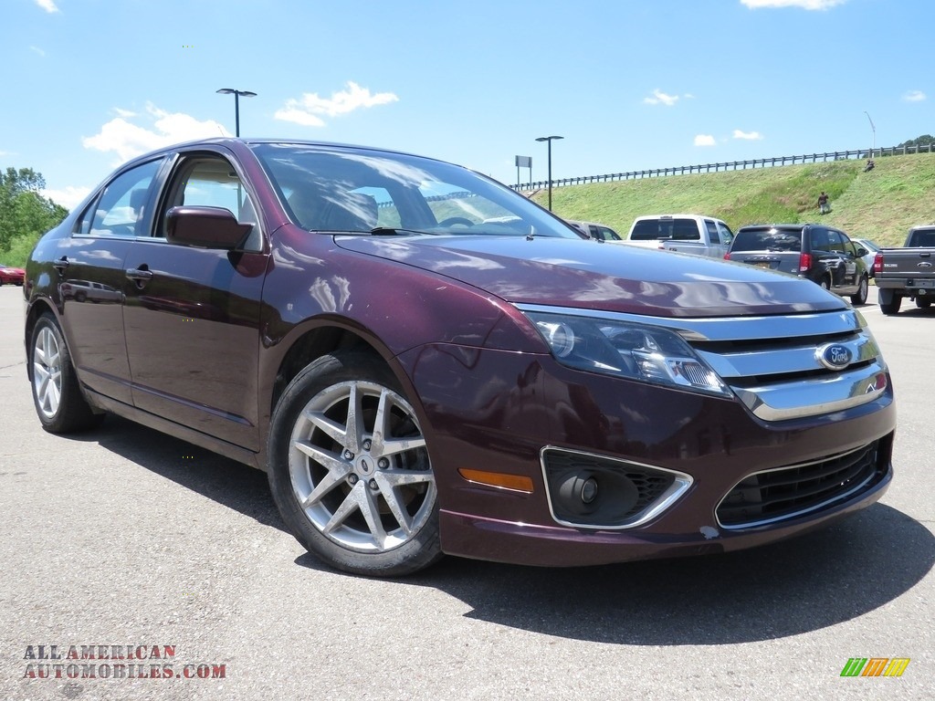 Red Candy Metallic / Medium Light Stone Ford Fusion SEL