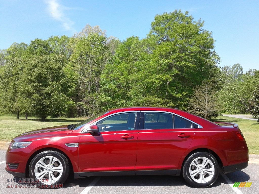Ruby Red / Charcoal Black Ford Taurus SEL