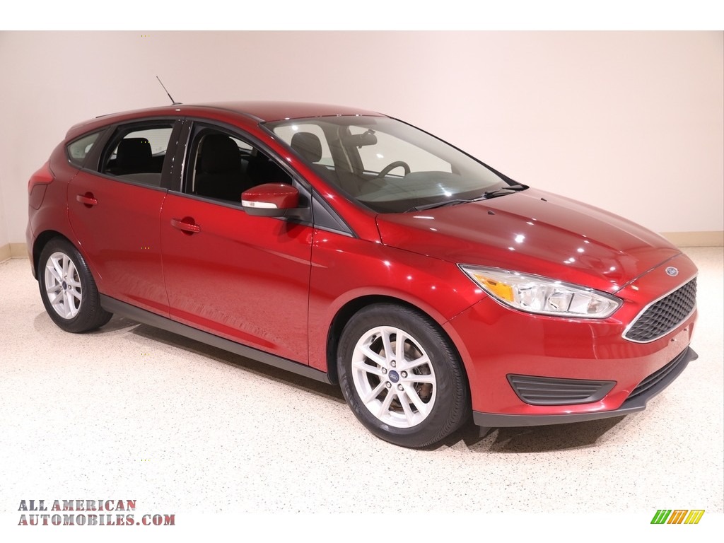 2017 Focus SE Hatch - Ruby Red / Charcoal Black photo #1