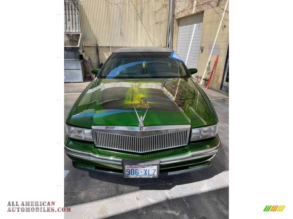 Polo Green Metallic / Tan Cadillac DeVille Sedan