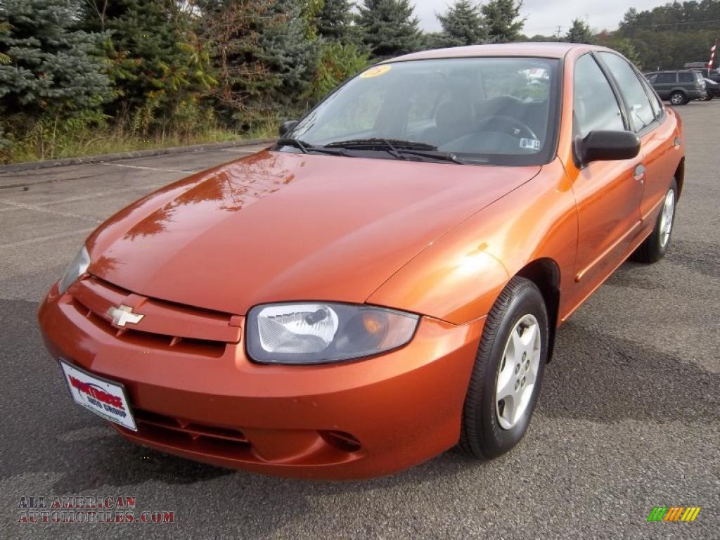 Sunburst Orange Metallic / Graphite Gray Chevrolet Cavalier Sedan