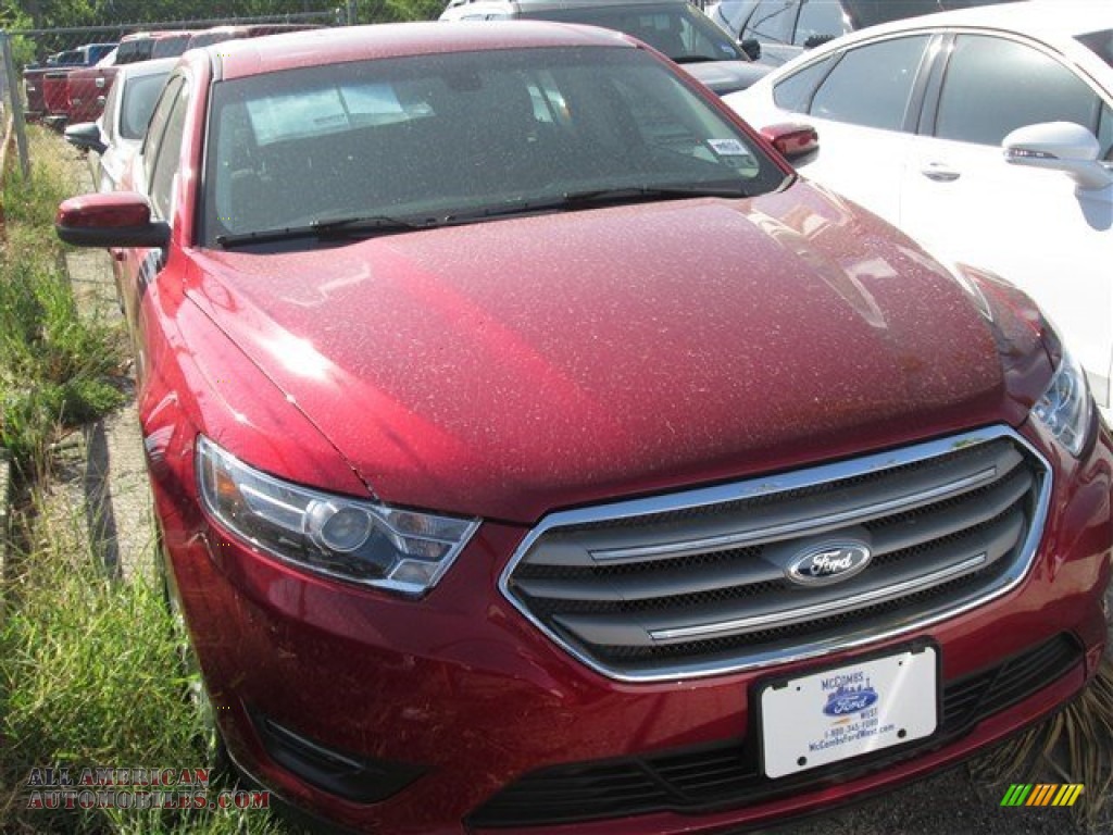 Ruby Red / Dune Ford Taurus SEL