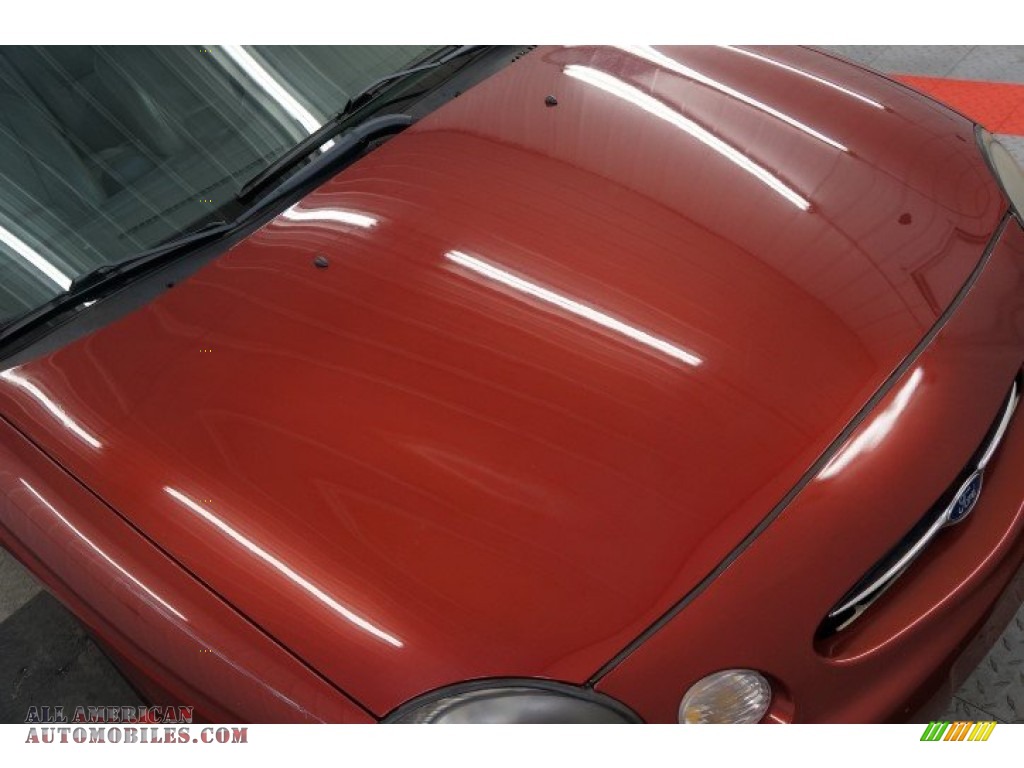 1999 Taurus SE - Toreador Red Metallic / Medium Graphite photo #37