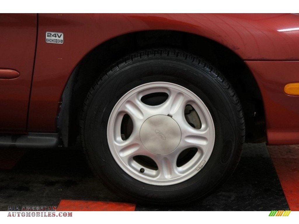 1999 Taurus SE - Toreador Red Metallic / Medium Graphite photo #39