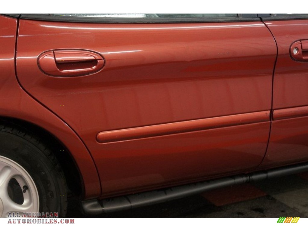 1999 Taurus SE - Toreador Red Metallic / Medium Graphite photo #44