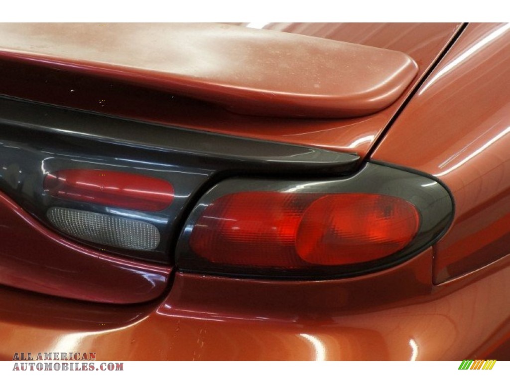 1999 Taurus SE - Toreador Red Metallic / Medium Graphite photo #48