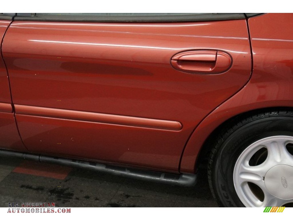1999 Taurus SE - Toreador Red Metallic / Medium Graphite photo #53