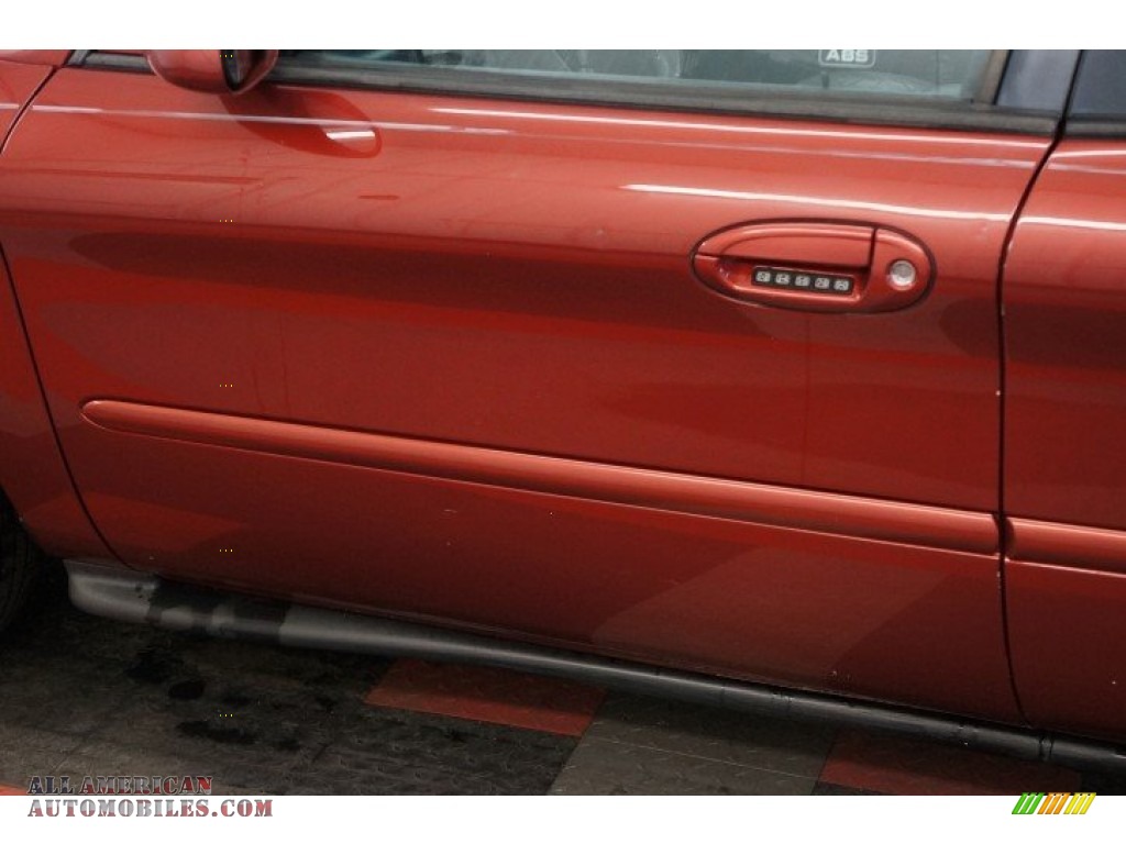 1999 Taurus SE - Toreador Red Metallic / Medium Graphite photo #54